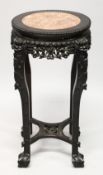 A CHINESE CARVED HARDWOOD AND MARBLE INSET VASE STAND, with pierced and carved frieze depicting