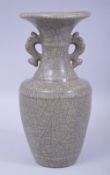 A CHINESE CRACKLE GLAZE CELADON TWIN HANDLE VASE, with four character mark to base, 25cm high.
