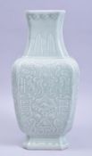 A CHINESE CELADON GLAZED PORCELAIN VASE, with lappet border and other decoration, impressed six