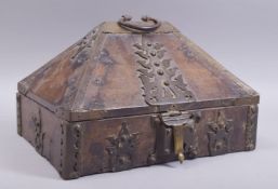 AN 18TH CENTURY WOOD AND IRON CASKET, the hinged lid with handle and latch, the interior with a