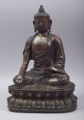 A GOOD 17TH/18TH CENTURY BRONZE MODEL OF BUDDHA, with traces of gilt and red paint, 30.5cm high.