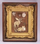 A FINE JAPANESE SMALL GILT FRAMED SHIBIYAMA PICTURE, depicting two deer and mother of pearl
