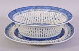 A CHINESE BLUE AND WHITE PIERCED PORCELAIN BASKET AND TRAY, the central interior painted with a