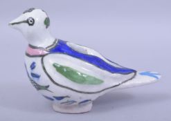 AN ISLAMIC GLAZED POTTERY BIRD / OIL LAMP, 18cm long.