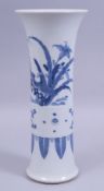 A CHINESE BLUE AND WHITE PORCELAIN GU VASE, decorated with birds amongst native flora and floral
