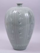 A KOREAN CELADON RIBBED CRACKLE GLAZE VASE, with native flora and flying crane, two character seal