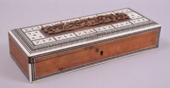 AN INDIAN SANDALWOOD RECTANGULAR GLOVE BOX WITH BONE AND EBONY DOMINO PIECES, box measuring 28.5cm