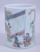 A CHINESE FAMILLE VERTE PORCELAIN BRUSH POT, decorated with figures in a landscape, 13.5cm high.