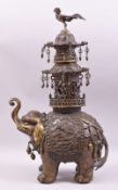 A FINE MEIJI BRONZE ELEPHANT KORO, the elephant cast with elaborate robes, carrying a three tier