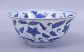 A CHINESE BLUE AND WHITE PORCELAIN BOWL, decorated to interior and the exterior with scrolling