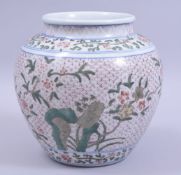 A LATE 19TH / EARLY 20TH CENTURY POLYCHROME PORCELAIN JAR, the body painted with plum blossom and