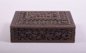 A 19TH CENTURY INDIAN CARVED WOODEN SPICE BOX, 13.5cm x 11cm.