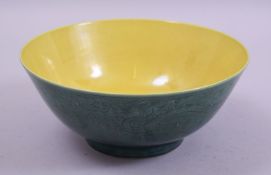 A CHINESE GREEN AND YELLOW GLAZE PORCELAIN BOWL, the exterior with incised decoration of dragons