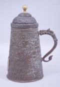 A TIBETAN HAMMERED COPPER COFFEE POT, hand beaten with mythical beasts and foliage with a dragon