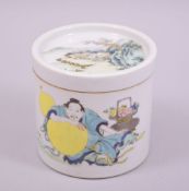 A CHINESE FAMILLE VERTE PORCELAIN BRUSH POT AND COVER, painted with a figure and a landscape, six