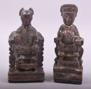 TWO 18TH CENTURY CHINESE CARVED WOODEN IMMORTAL FIGURES, 14cm and 13cm high.