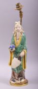 A CHINESE GREEN AND YELLOW PARTLY GLAZED POTTERY FIGURE mounted as a lamp, overall height 42cm