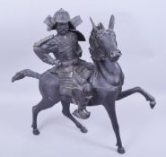 A LARGE JAPANESE MEIJI PERIOD SECTIONAL BRONZE MODEL OF SAMURAI WARRIOR ON HORSEBACK, samurai