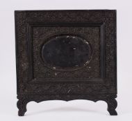 AN ISLAMIC INDIAN CEYLONESE CARVED EBONY PHOTO FRAME, carved with floral scroll, 24cm x 25.5cm