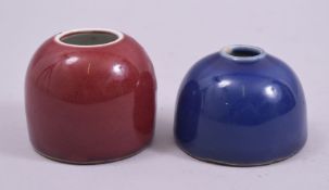 TWO GOOD CHINESE PORCELAIN INKWELLS, one with red glaze, the other with blue glaze, both with six
