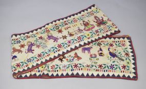 AN UNUSUAL CONTEMPORARY INDIAN EMBROIDERED BANNER, cream ground with embroider figures, animals,