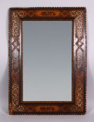 A 19TH CENTURY ISLAMIC SPANISH INLAID WOOD & MOTHER OF PEARL MIRROR- the frame inlaid with exotic