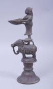 AN 18TH/19TH SOUTH INDIAN BRONZE DIPA LAKSHMI OIL LAMP, 23cm high.