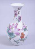 A 20TH CENTURY CHINESE REPUBLIC STYLE SMALL PORCELAIN VASE, decorated with flora and butterflies,