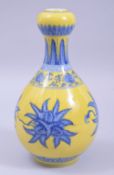 A CHINESE MING STYLE YELLOW GROUND GARLIC HEAD VASE, decorated with foliate motifs and lotus flower,