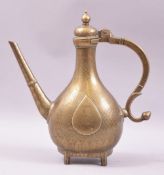 A GOOD HEAVY BRASS MUGHAL EWER, with engraved decoration, 30cm high.