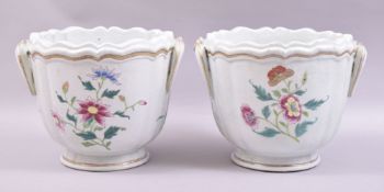 A PAIR OF CHINESE FAMILLE ROSE PORCELAIN WINE COOLERS, each with moulded handles and decorated