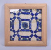 AN 18TH CENTURY POTTERY DAMASCUS TILE, framed, tile 22cm x 22cm.