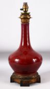 A CHINESE SANG DE BOEUF VASE / LAMP, with ormolu mounts, 51cm high.