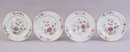 FOUR SMALL CHINESE FAMILLE ROSE PORCELAIN PLATES, each painted with a floral spray central, 16.5cm