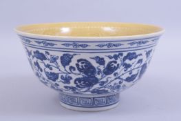 A CHINESE MING STYLE BLUE AND WHITE BOWL, the exterior painted with peach and pomegranate
