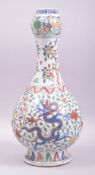 A CHINESE MING STYLE WUCAI BOTTLE VASE, painted with dragons and phoenix amongst stylised foliate