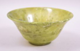 A SMALL CHINESE JADE BOWL, 12.5cm diameter.