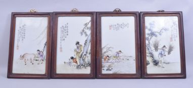 FOUR CHINESE PAINTED PORCELAIN PANELS in hardwood frames, painted with figures in various