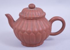 A CHINESE YIXING CLAY CHRYSANTHEMUM FORMED TEAPOT AND COVER, the base with an impressed seal mark,