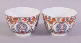 A PAIR OF UNUSUAL CHINESE PORCELAIN CUPS, painted with figures, animals and precious objects, the