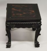 A SMALL CHINESE SQUARE FORM HARDWOOD TABLE, with carved floral frieze, supported on four curving