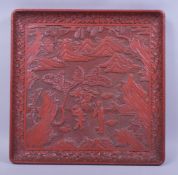 A SUPERB LARGE 19TH/20TH CHINESE CINNABAR LACQUER SQUARE FORM TRAY, the centre with a panel of