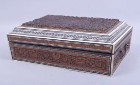 A 19TH CENTURY ANGLO INDIAN CARVED AND INLAID CASKET, inlaid with bone and micro mosaic, carved