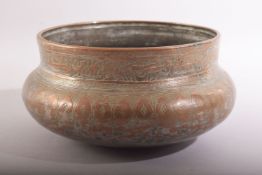 A GOOD ISLAMIC MAMLUK ENGRAVED AND CHASED COPPERED BRONZE BOWL, the rim with a band of calligraphy
