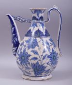 A LARGE CANTAGALLI IZNIK STYLE GLAZED POTTERY WATER EWER, painted with large flower heads and