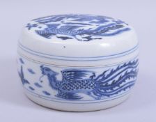 A CHINESE BLUE AND WHITE CYLINDRICAL PORCELAIN PHOENIX BOX AND COVER, decorated with phoenix and