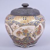 A JAPANESE MEIJI IMPERIAL SATSUMA KORO AND COVER, with panels decorated in enamel depicting flora,