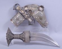 A FINE ISLAMIC ARABIAN SILVER MOUNTED HORN HILTED JAMBIYA DAGGER, 32cm long overall.