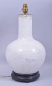 A CHINESE CRACKLE GLAZE LAMP VASE, mounted to a hardwood base, overall height 42cm.