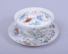 A CHINESE FAMILLE ROSE EGGSHELL PORCELAIN BOWL WITH COVER AND SAUCER, painted with floral sprays,